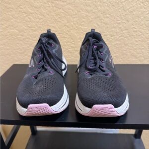 Skechers max cushion walking shoes.